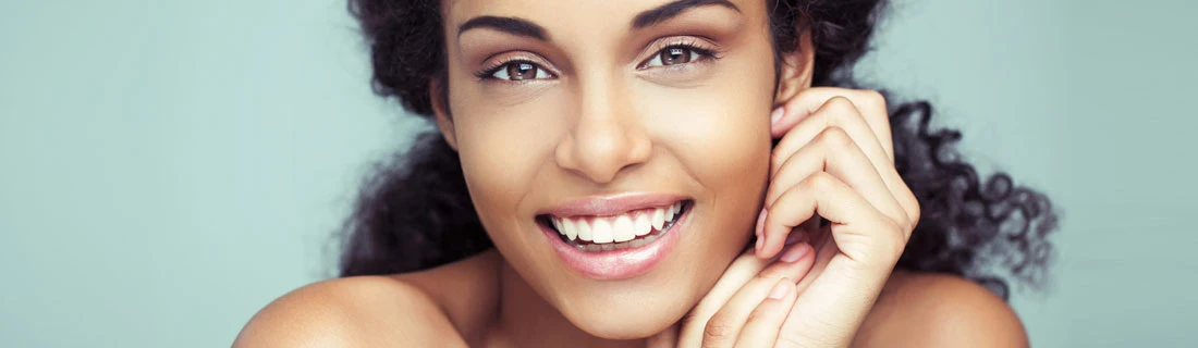 Woman Smiling With Hands By Face Woman Smiling With Hands By Face
