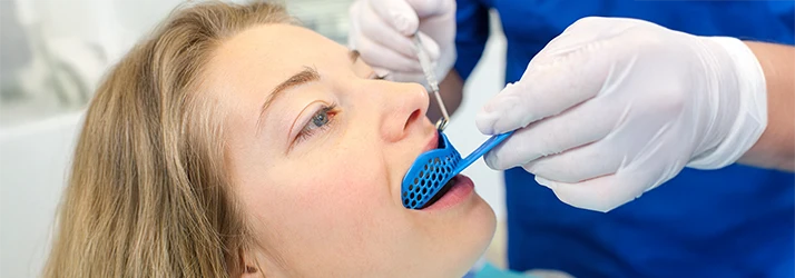Young patient getting fitted for a custom mouth guard at pediatric dentist, ensuring child dental protection. Young patient getting fitted for a custom mouth guard at pediatric dentist, ensuring child dental protection.