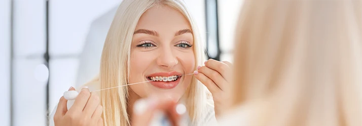 Orthodontics-Flossing-With-Braces-MultiORCS1.webp