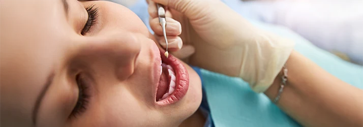 Close-up of a child receiving dental restoration treatment, highlighting pediatric dental care services. Close-up of a child receiving dental restoration treatment, highlighting pediatric dental care services.