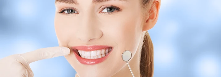Woman undergoing oral cancer screening during oral surgery examination. Woman undergoing oral cancer screening during oral surgery examination.