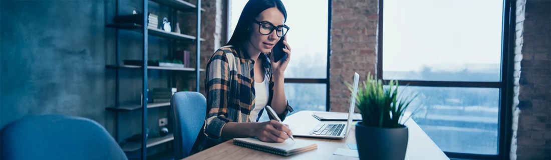 Woman scheduling her oral surgery appointment over the phone. Woman scheduling her oral surgery appointment over the phone.