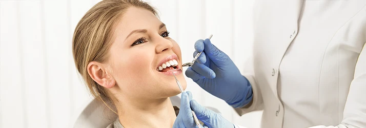 Periodontist utilizing advanced dental technology to plan precise surgical periodontal treatments.