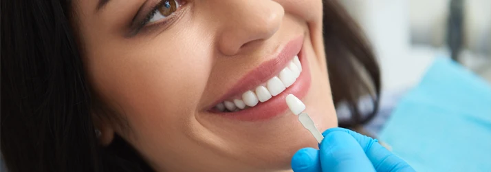 Woman-Getting-Teeth-Whitening-at-Cosmetic-Dentist.webp