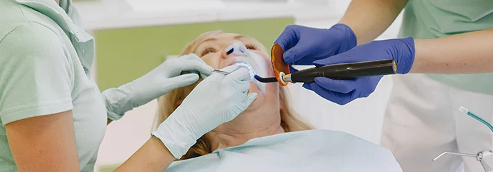 Lady-Receiving-A-Dental-Filling-At-The-Dentists-Office.webp
