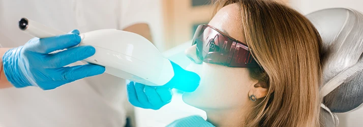 Lady-Receiving-Teeth-Whitening-Treatment.webp