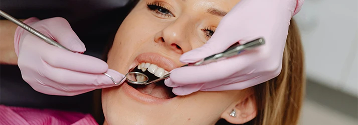 Woman-Receiving-A-Comprehensive-Dental-Exam.webp