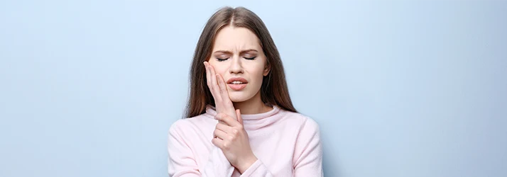 Woman-With-Root-Canal-Tooth-Pain.webp