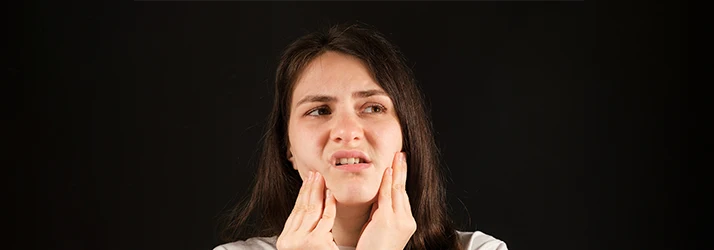 Woman-With-TMJ-Jaw-Pain.webp