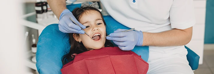Young-Child-Receiving-A-Dental-Exam.webp