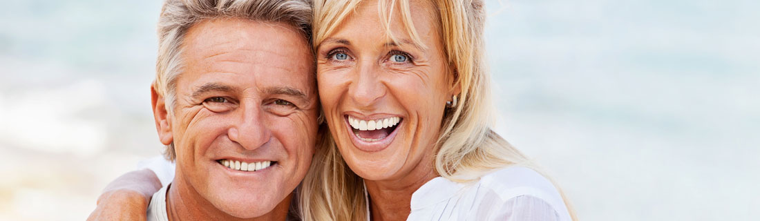 couple-older-at-beach-smiling.jpg