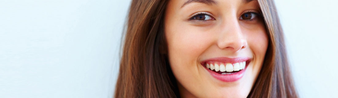 woman-pretty-smile-blue-background.jpg